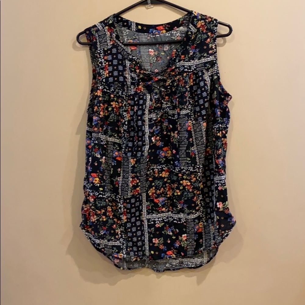 Sleeveless shirt with ties at neckline